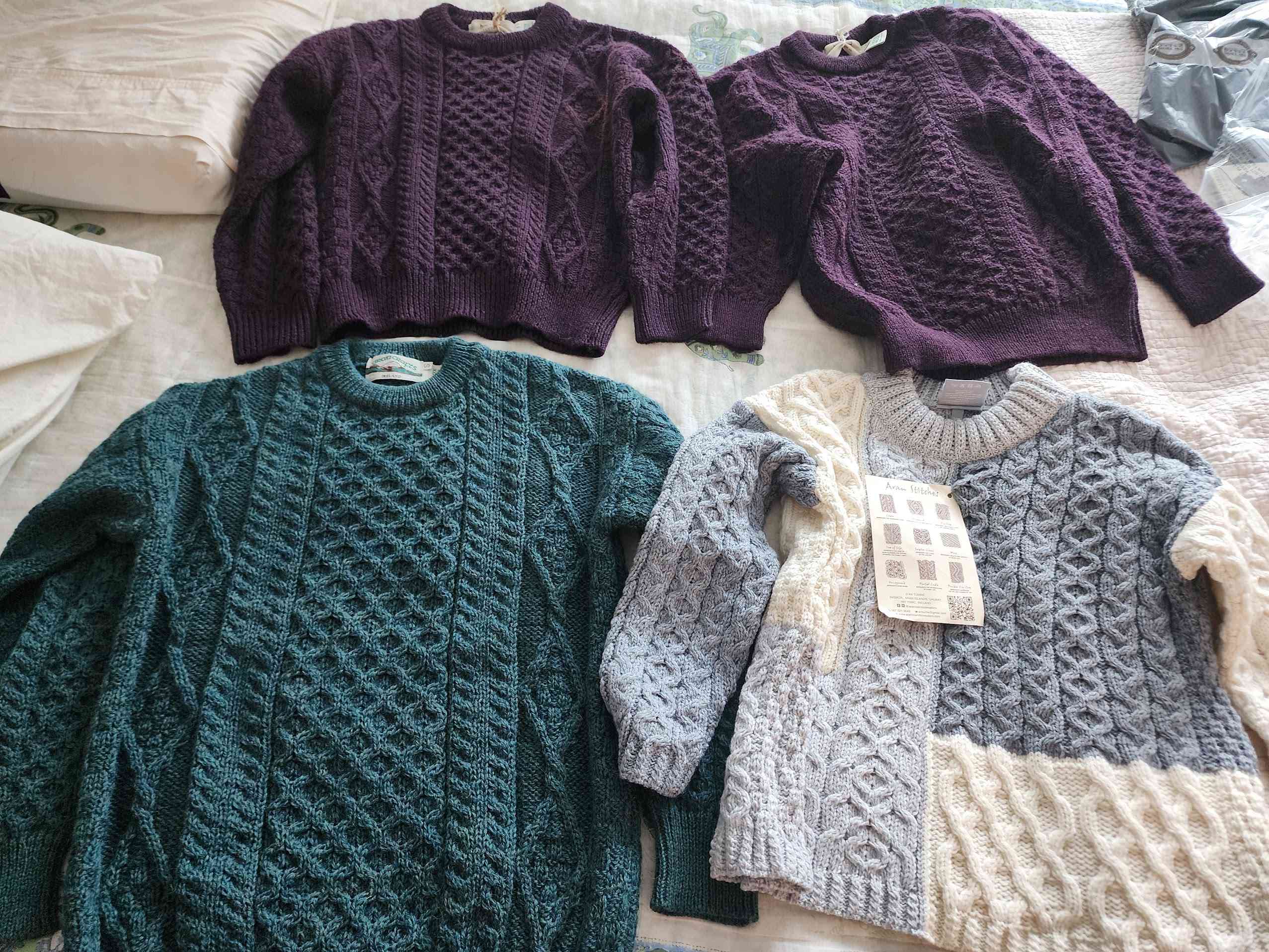 The cheaper sweaters: a blue-green one for me, patchwork for neha, and 2 burgundy ones for gifts for family